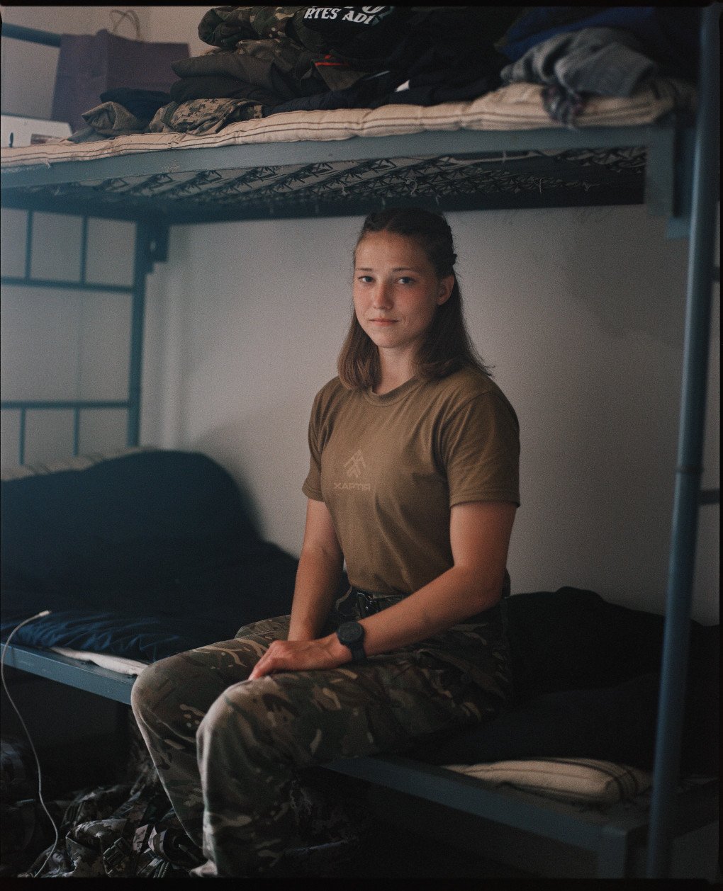 Former athlete Alina Shukh with the callsign Somatra poses for a photo in her room at the permanent deployment point, Kharkiv region, July 2025. (Source: Joshua Olley) Former athlete Alina Shukh with the callsign Somatra poses for a photo in her room at the permanent deployment point, Kharkiv region, July 2025. (Source: Joshua Olley)