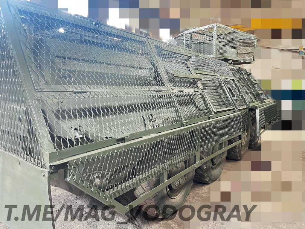 Rear angle of a BTR displaying extended cage armor and layered mesh canopy designed to disrupt FPV drone attacks. (Source: Telegram/MAG_VODOGRAY)