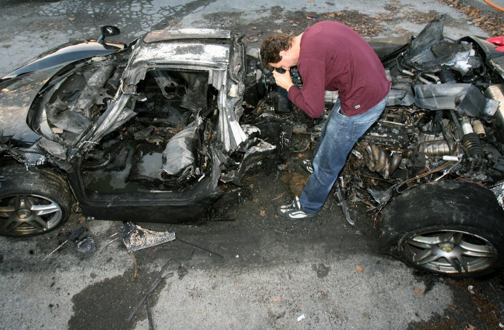 A journalist films the wreck of a black Ferrari that crashed into a tree and burst into flames in Nice on 26 November 2006, injuring Russian oligarch Suleiman Kerimov and a female passenger. (Source: Getty Images) A journalist films the wreck of a black Ferrari that crashed into a tree and burst into flames in Nice on 26 November 2006, injuring Russian oligarch Suleiman Kerimov and a female passenger. (Source: Getty Images)