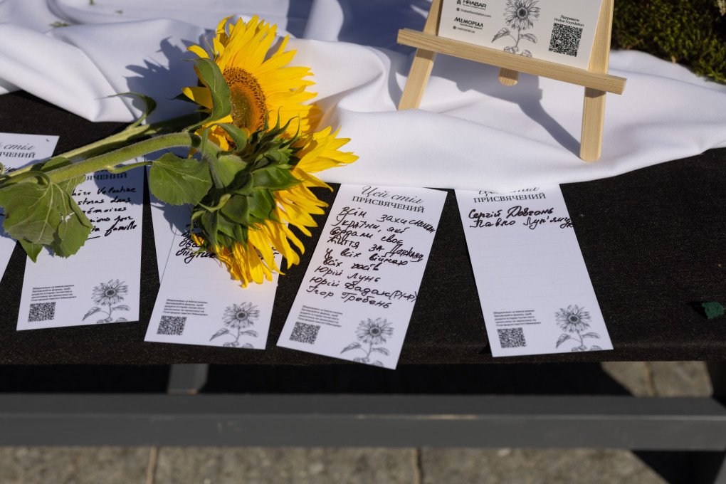 Remembrance cards on a Memory Table. (Photo: Vic Bakin/UNITED24 Media) Remembrance cards on a Memory Table. (Photo: Vic Bakin/UNITED24 Media)