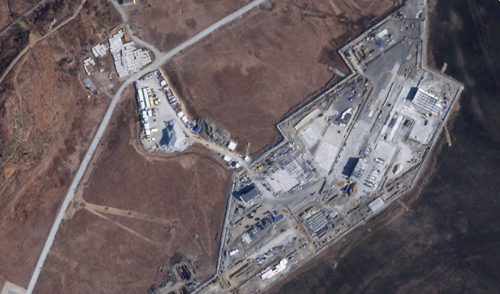 Satellite imagery shows construction of a large Russian border checkpoint and customs facility near the new Tumen River road bridge. (Source: The Guardian / Ukrainian human rights organization Truth Hounds)