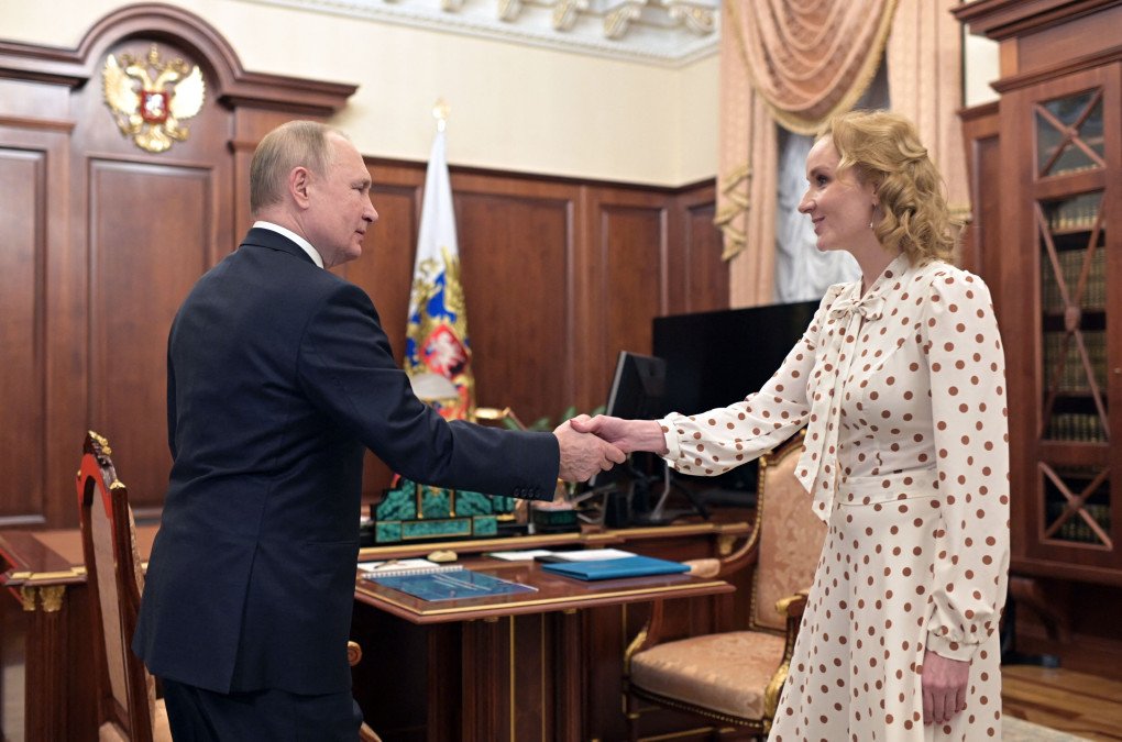 Russian leader Vladimir Putin meets with Commissioner for Children's Rights Maria Lvova-Belova at the Kremlin in Moscow on March 9, 2022. (Photo by MIKHAIL KLIMENTYEV/SPUTNIK/AFP via Getty) Russian leader Vladimir Putin meets with Commissioner for Children's Rights Maria Lvova-Belova at the Kremlin in Moscow on March 9, 2022. (Photo by MIKHAIL KLIMENTYEV/SPUTNIK/AFP via Getty)