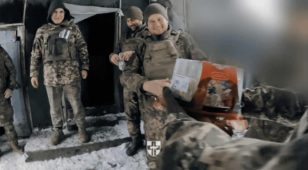 Soldiers of the 78th Separate Airborne Assault Brigade receive New Year’s gifts delivered directly to their frontline positions by a ground drone. (Source: 78th Separate Airborne Assault Brigade)