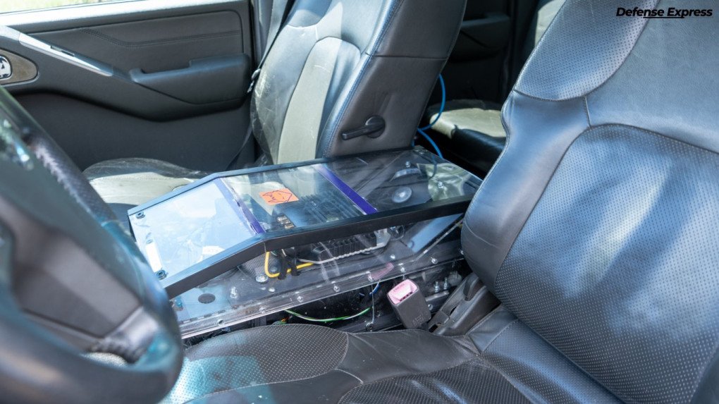 Remote-control hardware installed inside a modified Nissan Navara pickup. (Source: Defense Express)
