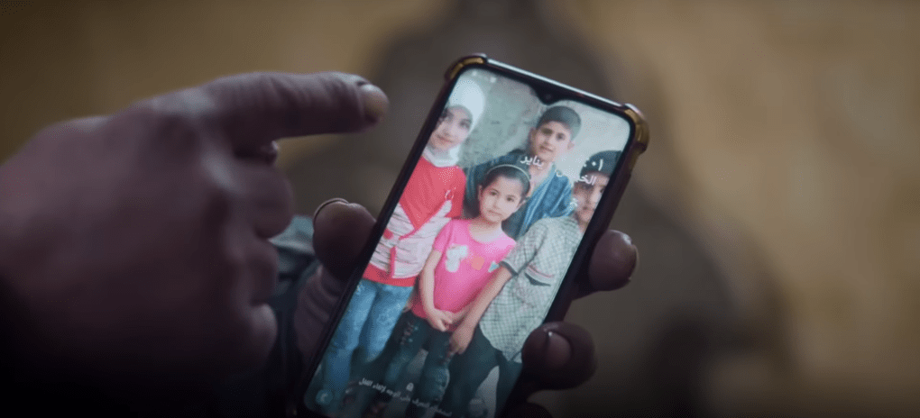 Tawfiq points to a photo of his four children who died in the chemical attack. (Source: Audrey MacAlpine and Caolan Robertson) Tawfiq points to a photo of his four children who died in the chemical attack. (Source: Audrey MacAlpine and Caolan Robertson)