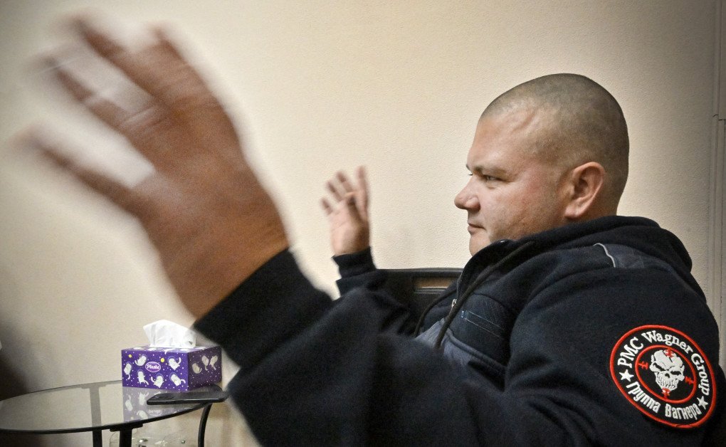 former member of a private mercenary group Wagner, talks to a psychotherapist in a rehabilitation centre in the town of Zhukovsky, outside Moscow. (Photo by Alexander Nemenov via Getty Images)