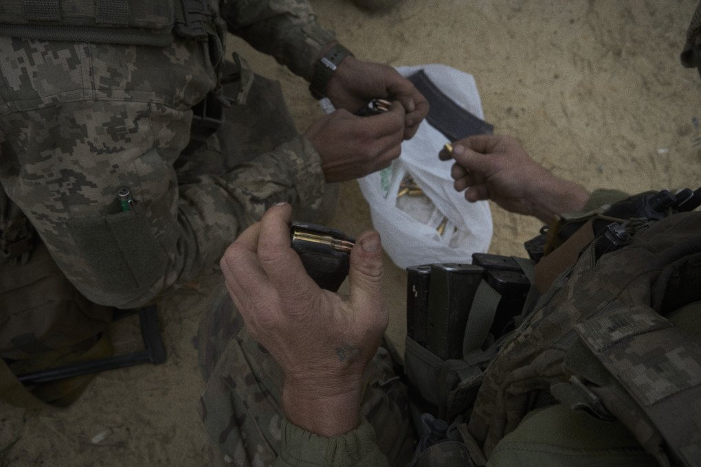 Stormtroopers from the 93d Brigade load their weapons. Photo by Joshua Olley/UNITED24 Media