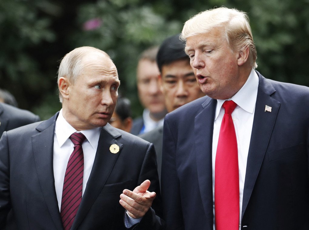 US President Donald Trump (R) and Russia’s leader Vladimir Putin talk as they make their way to take the “family photo” during the Asia-Pacific Economic Cooperation leaders' summit in the central Vietnamese city of Danang on November 11, 2017. (Source: Getty Images) US President Donald Trump (R) and Russia’s leader Vladimir Putin talk as they make their way to take the “family photo” during the Asia-Pacific Economic Cooperation leaders' summit in the central Vietnamese city of Danang on November 11, 2017. (Source: Getty Images)