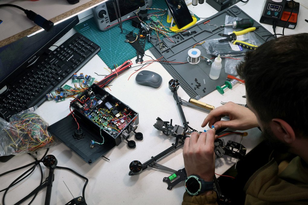 A specialist works in the UAV workshop of the 13th Khartiia Brigade. Here, experts assemble, upgrade, and repair reconnaissance and combat drones that meet the unit's operational requirements in field conditions. Photo: Getty Images.