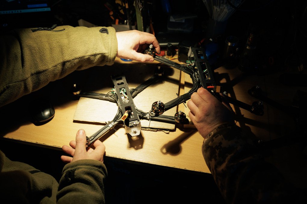 A Ukrainian serviceman of the UAV unit “Bulava” repairs a drone in a workshop on February 16, 2025 in Unspecified, Ukraine. (Photo by Serhii Mykhalchuk via Getty Images)