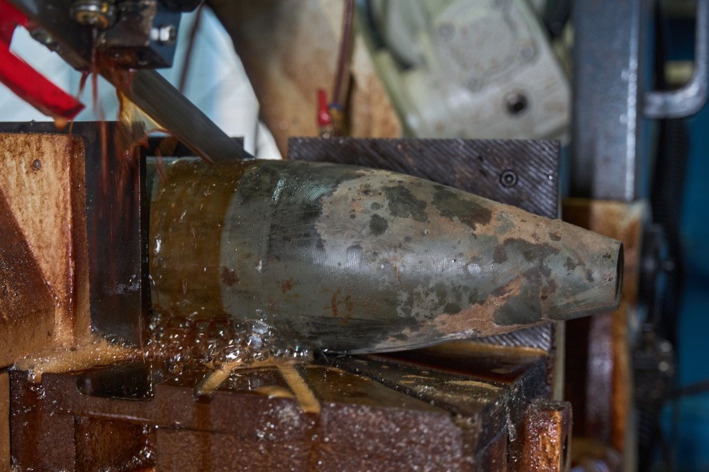 A shell is opened to extract explosives that will be used in smaller munitions like drones. (Source: UNITED24 Media/ Mykyta Shandyba)