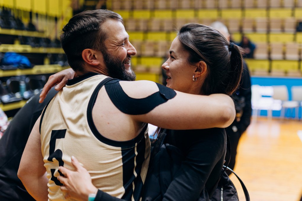 A basketball player shares an emotional post-game hug with a supporter after a match at the All-Ukrainian Tournament for veterans. Photo: Serhii Halushka, Come Back Alive Foundation A basketball player shares an emotional post-game hug with a supporter after a match at the All-Ukrainian Tournament for veterans. Photo: Serhii Halushka, Come Back Alive Foundation