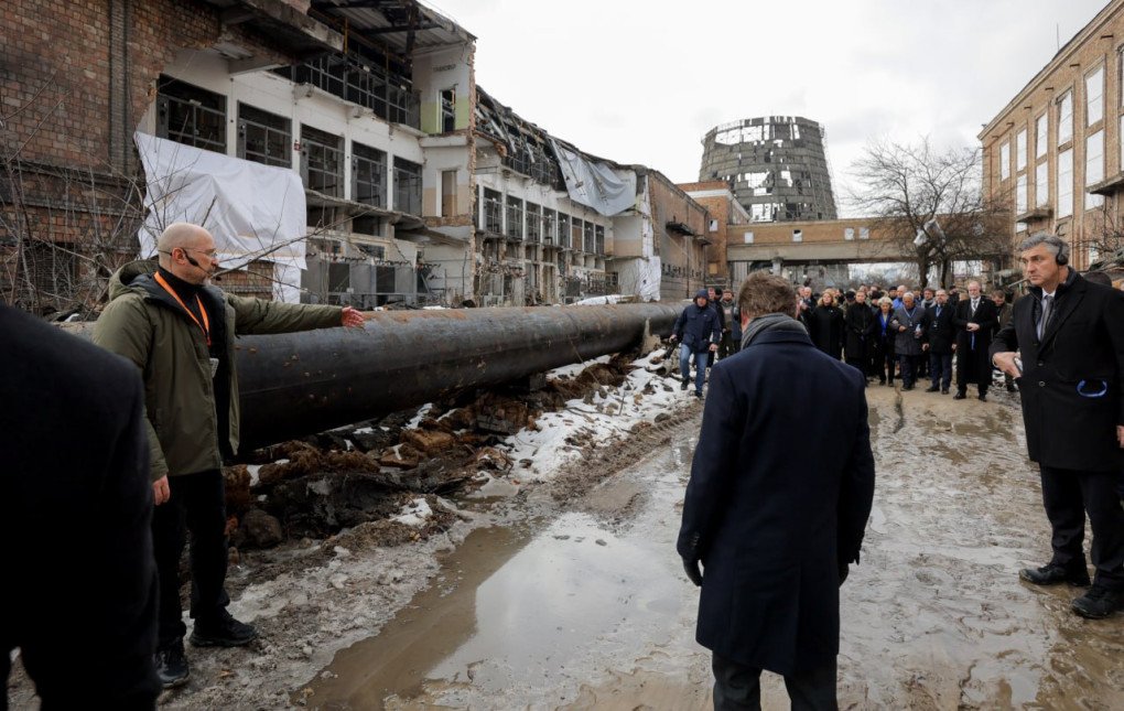 Shmyhal points out a damaged industrial pipe to the delegation, calling the heavily bombed heating facility both a crime scene and a symbol of resilience. (Source: Denys Shmyhal)