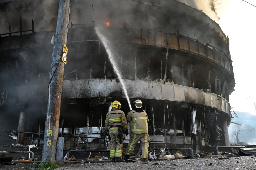 Ukrainian firefighters try to stop fire in a heavily damaged building following Russian strikes in Kyiv. (Photo by Aleksandr Gusev via Getty Images)