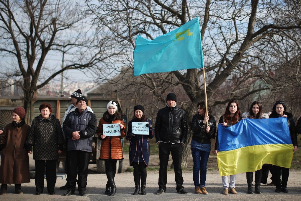Protesters including Ukrainians and Tatar join a protest against the forthcoming referendum in Crimea on March 14, 2014 in Simferopol, Ukraine. (Photo by Dan Kitwood via Getty Images) Protesters including Ukrainians and Tatar join a protest against the forthcoming referendum in Crimea on March 14, 2014 in Simferopol, Ukraine. (Photo by Dan Kitwood via Getty Images)