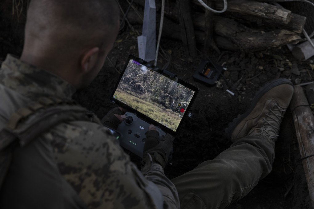 Victor Stelmakh, the head of an attack drone unit in the 68th Jaeger Brigade, rests a Starlink-connected phone on his body armor to communicate with other soldiers while piloting a drone in Luhansk region on September 1,2023. (Photo: Heidi Levine via Getty Images) Victor Stelmakh, the head of an attack drone unit in the 68th Jaeger Brigade, rests a Starlink-connected phone on his body armor to communicate with other soldiers while piloting a drone in Luhansk region on September 1,2023. (Photo: Heidi Levine via Getty Images)