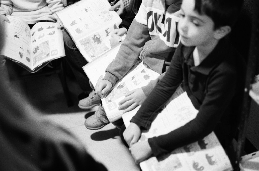 First-graders sit in the shelter during an air raid alert, holding their primers on their laps. (Photo: Max Lysenko/UNITED24 Media) First-graders sit in the shelter during an air raid alert, holding their primers on their laps. (Photo: Max Lysenko/UNITED24 Media)