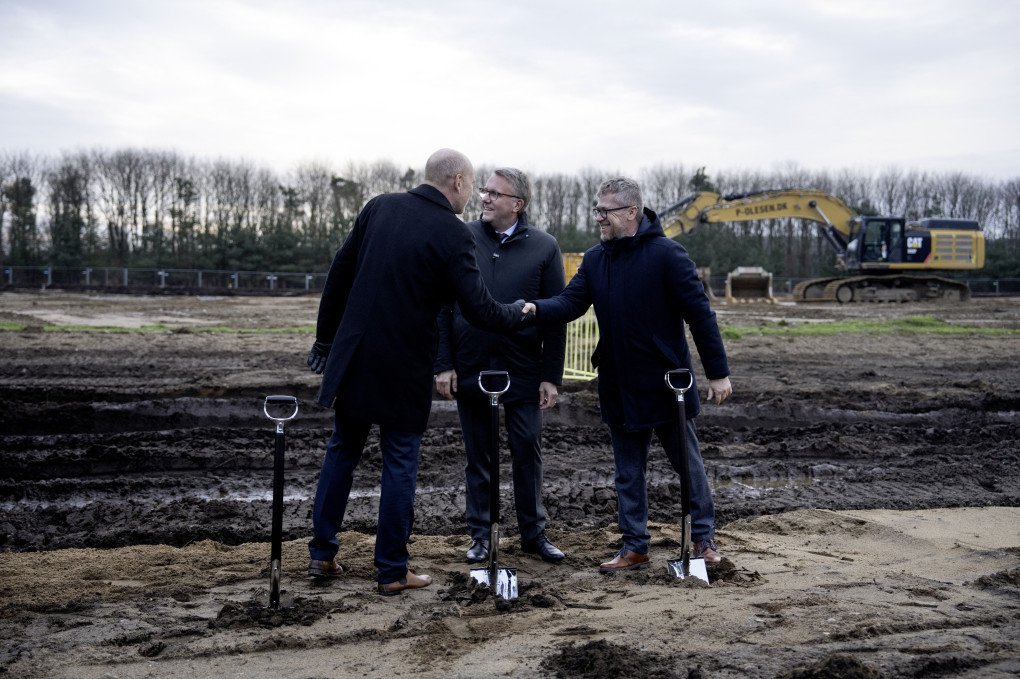 Denmark's Minister for Industry, Business and Financial Affairs, Morten Boedskov, Mayor of Haderslev Municipality, Mads Skau, and Director of Ukrainian defence technology company Fire Point in Denmark, Vyacheslav Bondarchuk, shake hands during the first groundbreaking at the site of Fire Point's new factory in Vojens, Southern Jutland, on December 1, 2025. Photo by Bo Amstrup/Ritzau Scanpix/AFP via Getty Images