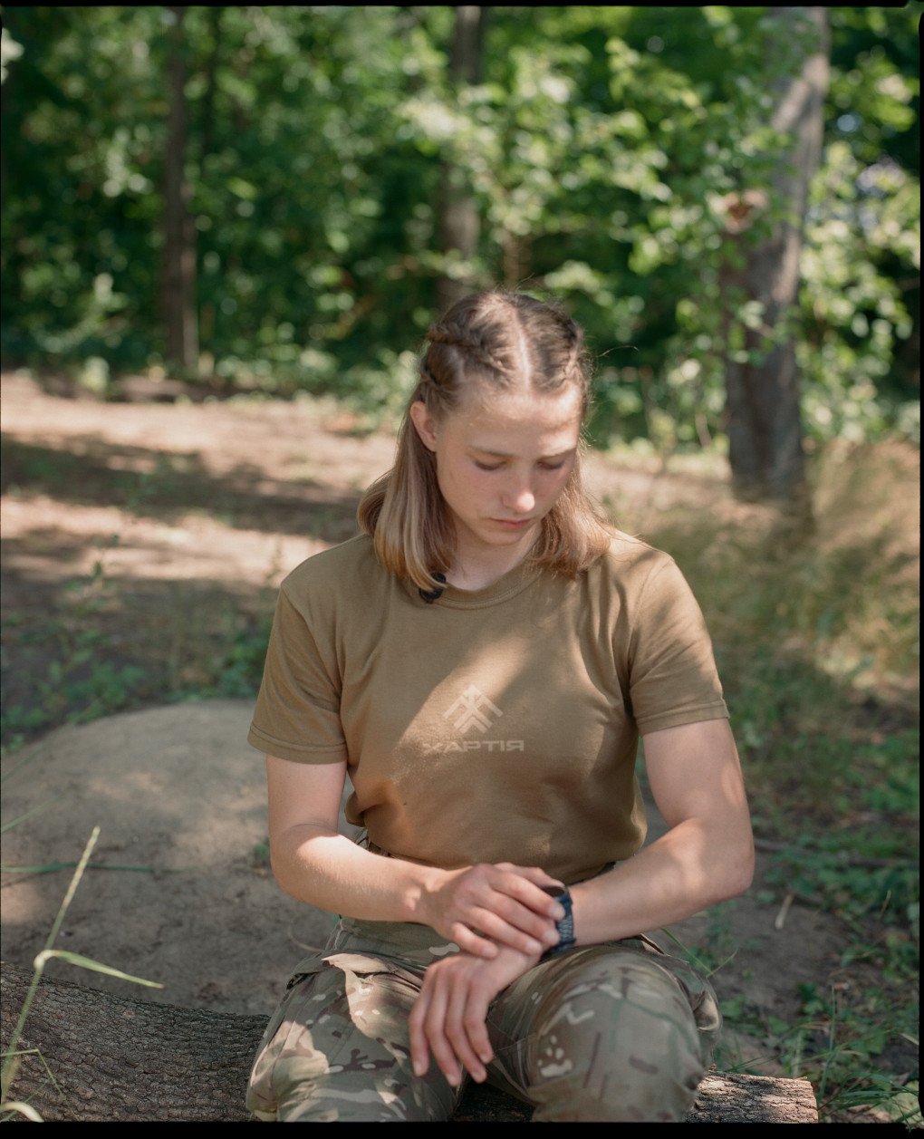 Former athlete Alina Shukh, callsign Somatra, is checking the time, Kharkiv region, July 2025. (Source: Joshua Olley) Former athlete Alina Shukh, callsign Somatra, is checking the time, Kharkiv region, July 2025. (Source: Joshua Olley)