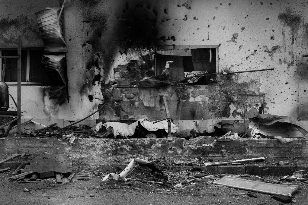 The facade of a restaurant in Dniprovskyi, charred by an explosion. Kherson, Ukraine, May 2026. Photo: Joshua Olley / UNITED24 Media.