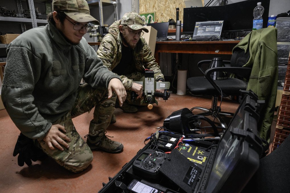 Members of the 3rd Army Corps Interception Squadron check the delivery of a mobile workstation used to control interceptor drones. (Photo by Ed Jones via Getty Images) Members of the 3rd Army Corps Interception Squadron check the delivery of a mobile workstation used to control interceptor drones. (Photo by Ed Jones via Getty Images)