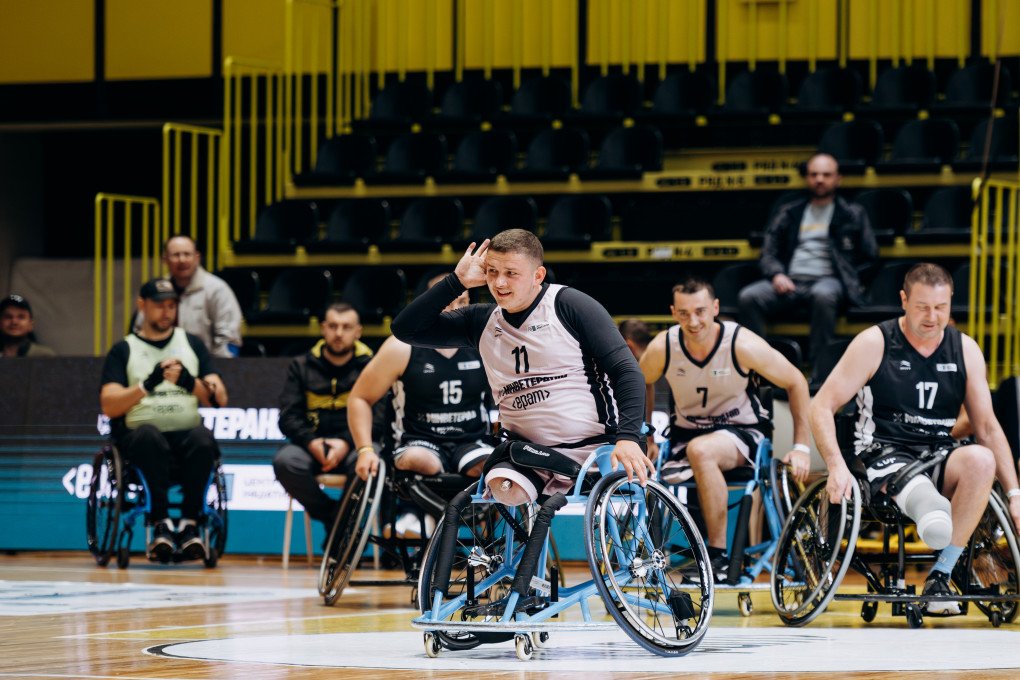 Ukrainian para-athlete Oleksandr Tolochenko (#11) celebrates a play with a playful gesture, energizing teammates and fans during the All-Ukrainian Wheelchair Basketball Tournament. Photo: Serhii Halushka, Come Back Alive Foundation Ukrainian para-athlete Oleksandr Tolochenko (#11) celebrates a play with a playful gesture, energizing teammates and fans during the All-Ukrainian Wheelchair Basketball Tournament. Photo: Serhii Halushka, Come Back Alive Foundation