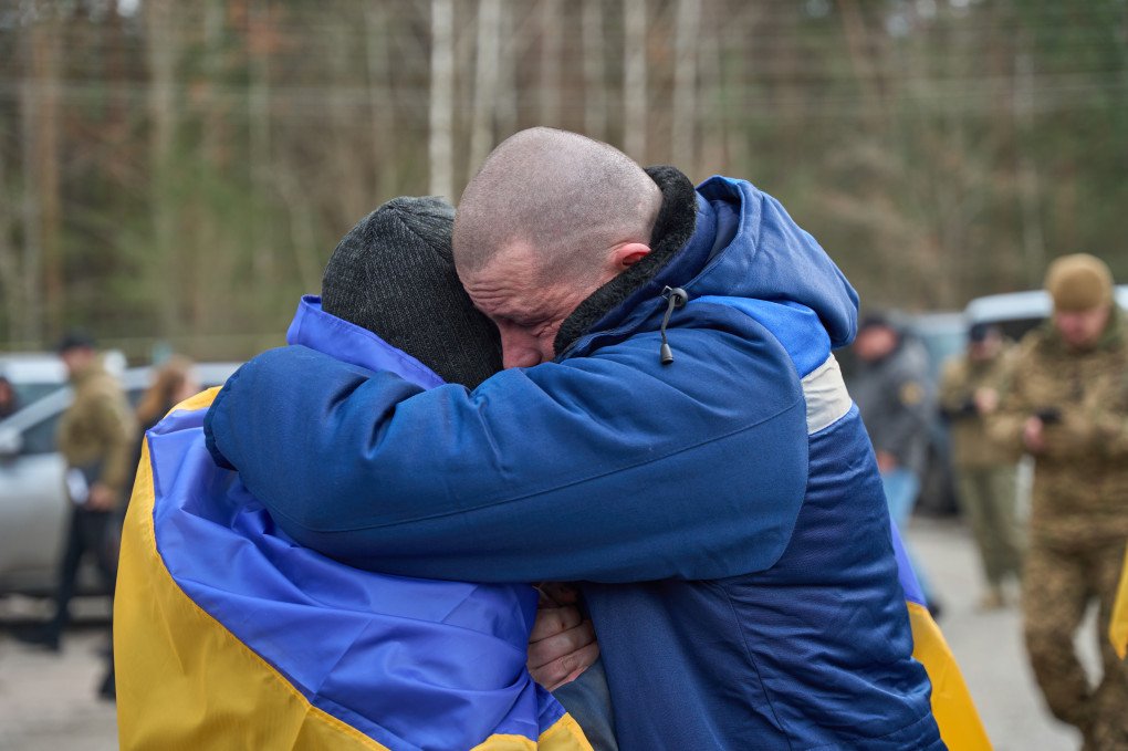 Two freed Ukrainian defenders embrace each other after returning from Russian captivity, March 6, 2026, undisclosed location, Ukraine. Photo by Mykyta Shandyba, UNITED24 Media