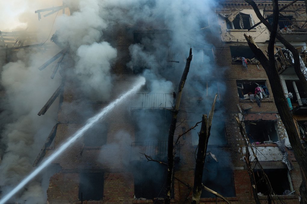 A firefighter directs water into a damaged residential building in Kyiv after Russia’s mass overnight attack on May 24. (Photo: UNITED24 Media/Mykyta Shandyba)