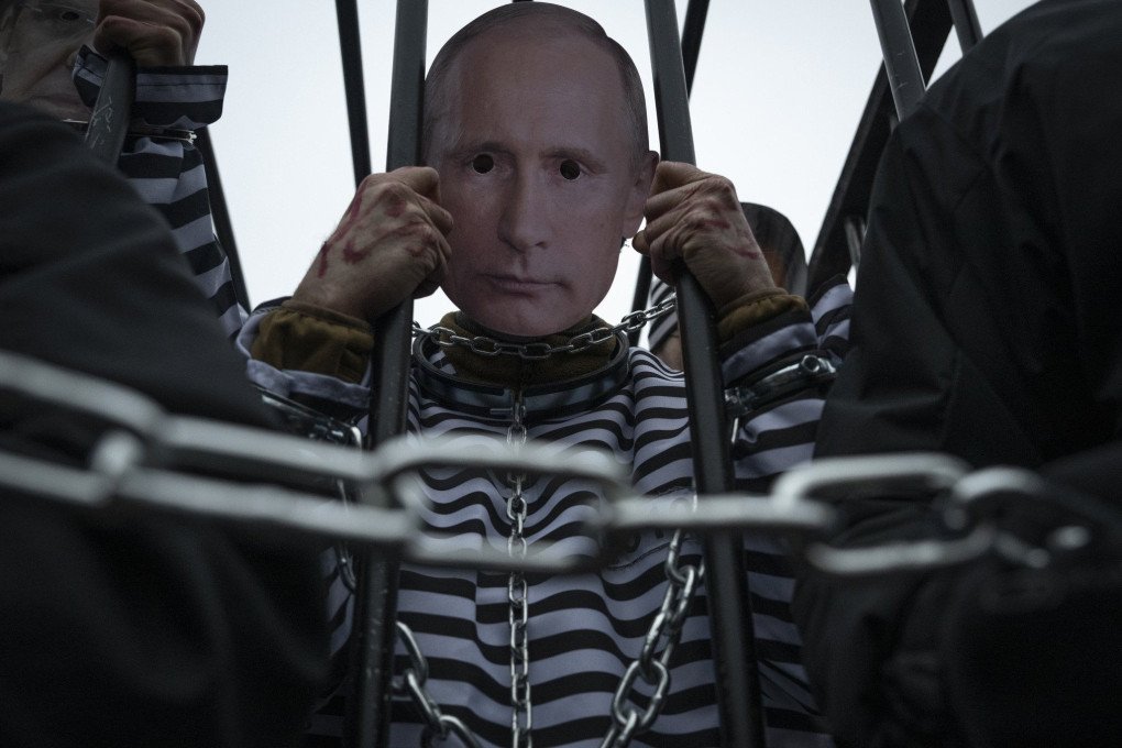 Warsaw protest mock trial Putin prison overalls Ukraine Day of Unity international tribunal war crimes