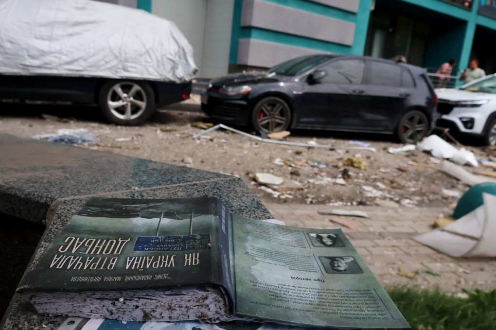 Books are scattered among the debris near a residential building damaged by Russian missile strikes in Kyiv, Ukraine, June 24, 2023. The book at the forefront is “'How Ukraine lost Donbas” by Denys Kazanskyi and Maryna Vorotyntseva on the onset of Russia’s military intervention into Ukrainian territory in 2014. Photo by Aleksandr Gusev/SOPA Images/LightRocket via Getty Images.