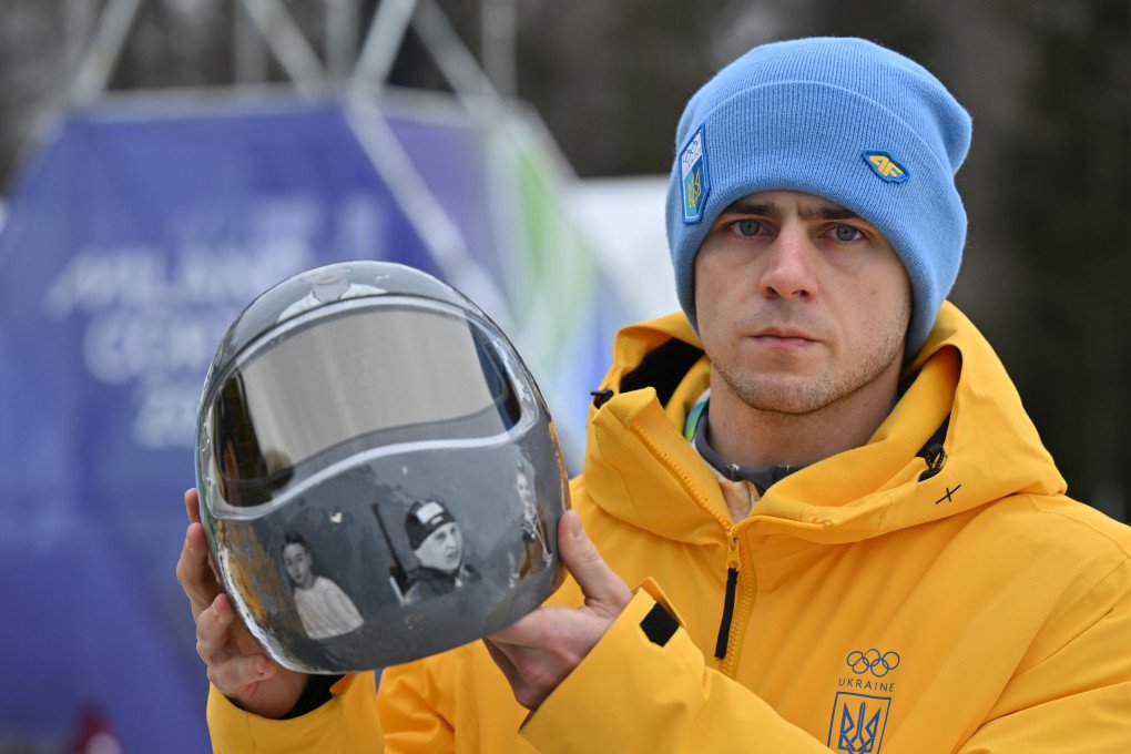 Heraskevych shows his helmet with pictures of fellow athletes killed in the war. Photo by Robert Michael/picture alliance via Getty Images. Heraskevych shows his helmet with pictures of fellow athletes killed in the war. Photo by Robert Michael/picture alliance via Getty Images.