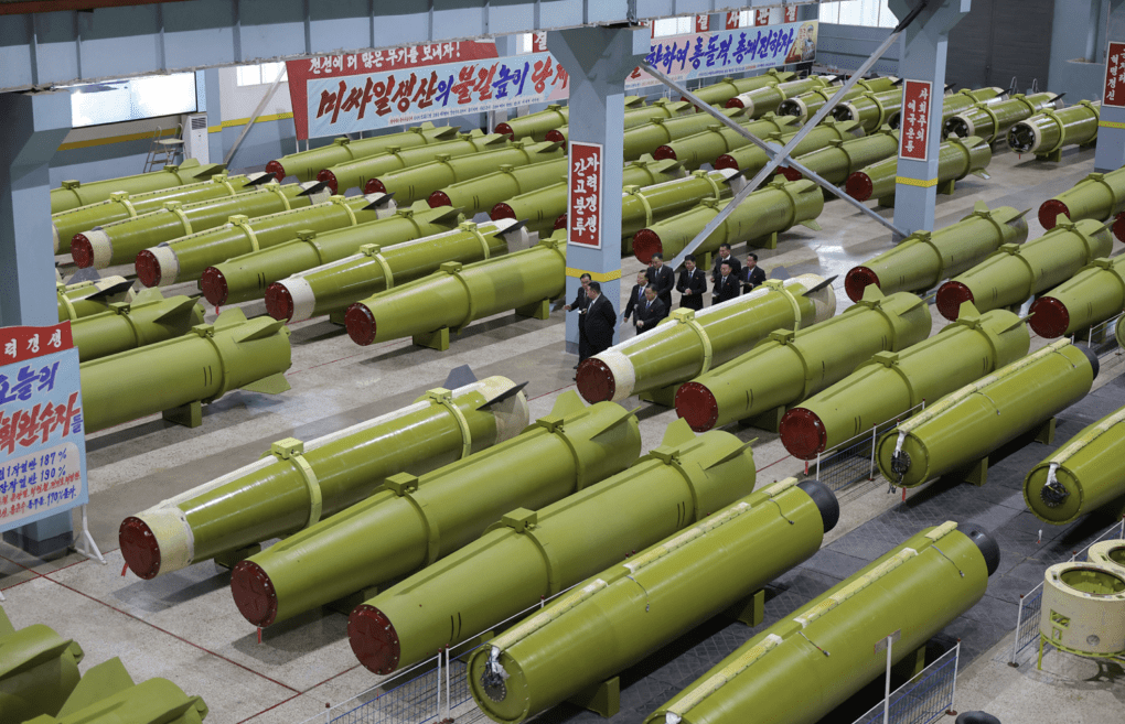 Rows of missile bodies are shown inside a North Korean munitions facility. (Source: KCNA)