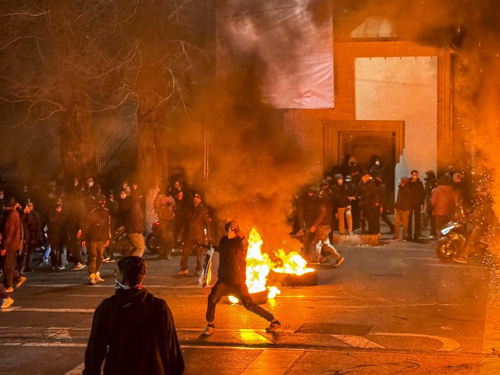 Iranians gather while blocking a street during a protest in Tehran, Iran on January 9, 2026.  (Photo by MAHSA / Middle East Images / AFP via Getty Images)