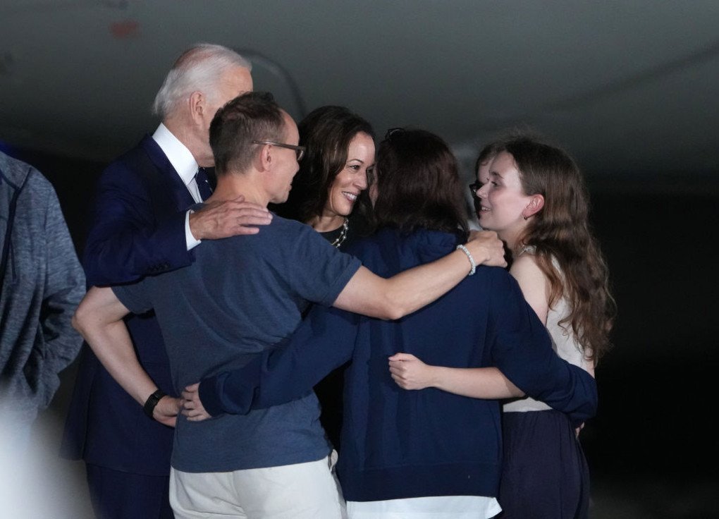US President Joe Biden and Democratic presidential candidate, US Vice President Kamala Harris embrace the family of freed prisoner Alsu Kurmasheva after she arrived at Joint Base Andrews on August 1, 2024 at Joint Base Andrews, Maryland. (Source: Getty Images) US President Joe Biden and Democratic presidential candidate, US Vice President Kamala Harris embrace the family of freed prisoner Alsu Kurmasheva after she arrived at Joint Base Andrews on August 1, 2024 at Joint Base Andrews, Maryland. (Source: Getty Images)