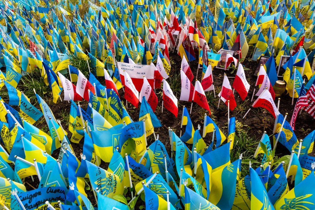 Polish flags among blue and yellow Ukrainian national flags with names of fallen soldiers are seen on Maidan Nezalezhnosti (Independence Square) in central Kyiv, the capital of Ukraine on May 11, 2023. (Photo by Dominika Zarzycka via Getty Images) Polish and Ukrainian national flags with names of fallen soldiers