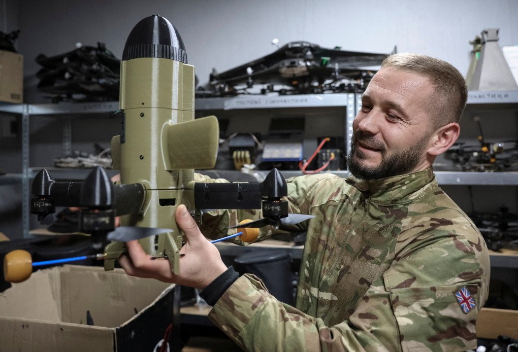 A serviceman from the SQUADRON interceptor unit of the 3rd Army Corps of the Ukrainian Armed Forces demonstrates a Ukrainian drone-interceptor Sting, amid Russia's attack on Ukraine, near the frontline in eastern Ukraine, October 30, 2025. (Source: REUTERS)