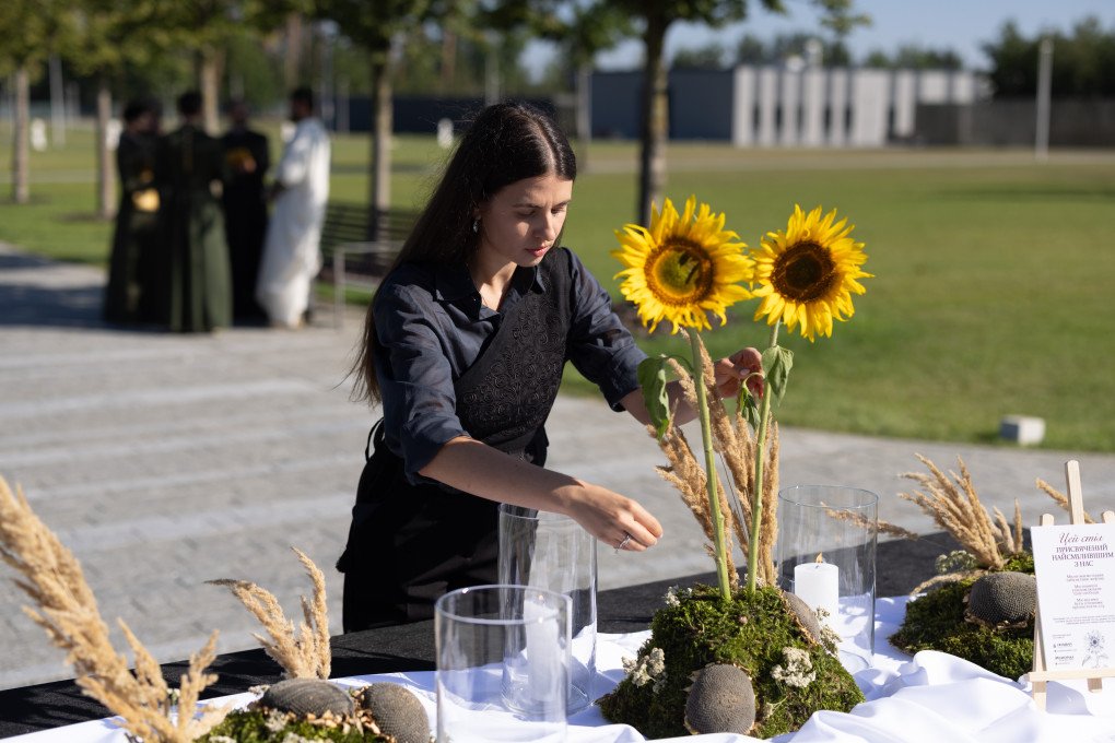 Maria beside one of the Memory Tables set up for Ukraine’s Day of Remembrance for Defenders. (Photo: Vic Bakin/UNITED24 Media) Maria beside one of the Memory Tables set up for Ukraine’s Day of Remembrance for Defenders. (Photo: Vic Bakin/UNITED24 Media)