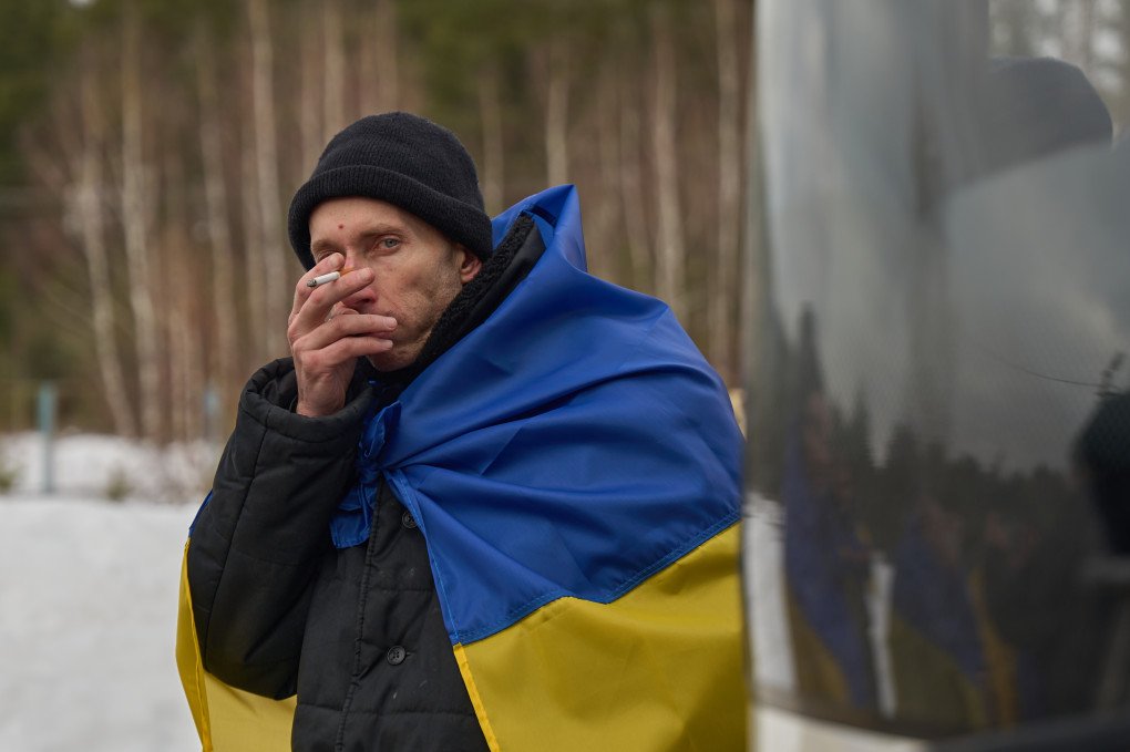 A freed Ukrainian defender smokes a cigarette while looking into the camera during the second day of the prisoner exchange between Ukraine and Russia, March 6, 2026, undisclosed location, Ukraine. Photo by Mykyta Shandyba, UNITED24 Media
