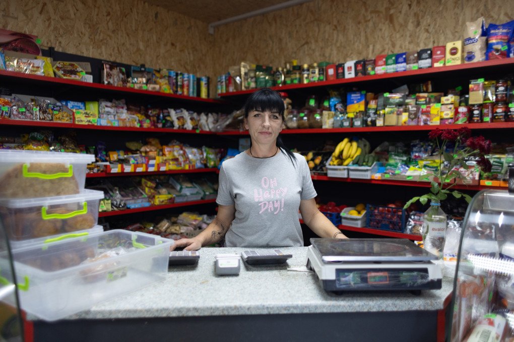 Shop assistant Victoria behind the counter in Hrakove. (Photo: Vic Bakin/UNITED24 Media) Shop assistant Victoria behind the counter in Hrakove. (Photo: Vic Bakin/UNITED24 Media)