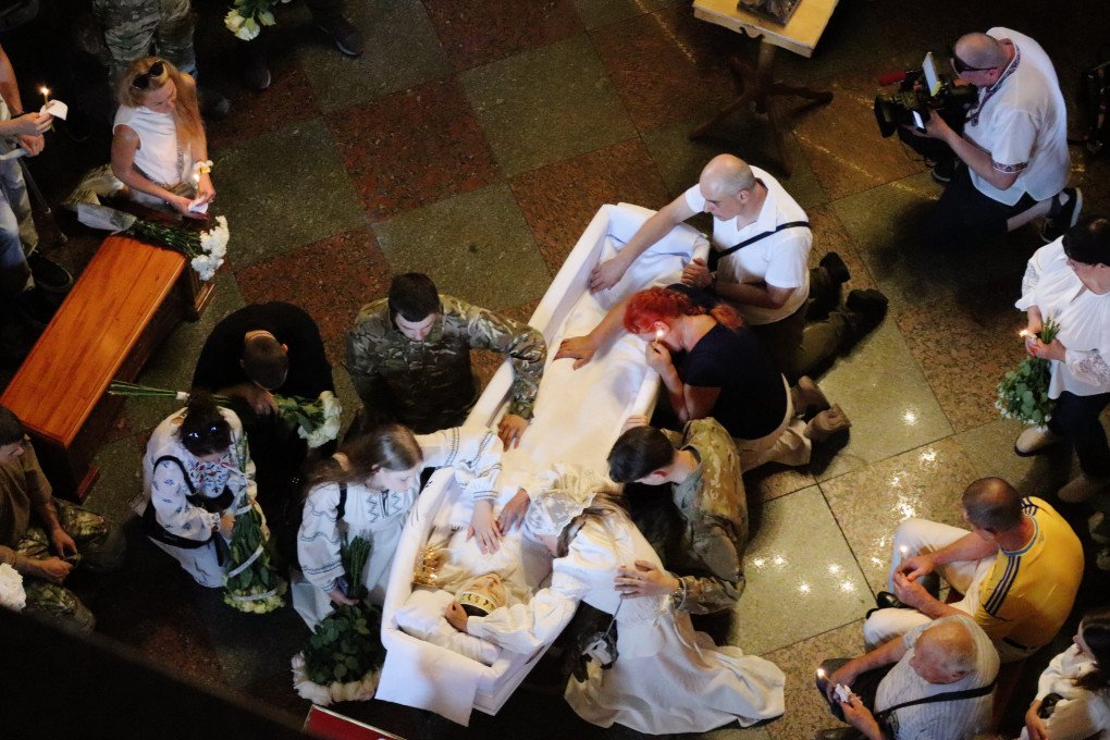 The farewell to 20-year-old Vitalina Yarovenko takes place in St. Michael's Cathedral on August 4, 2026 in Kyiv, Ukraine. On August 4, mourners gathered for the funeral of 20-year-old Vitalina Yarovenko in Kyiv. The young volunteer medic rushed to help victims after an initial Russian strike but was killed during a subsequent double-tap attack. (Photo by Andriy Zhyhaylo via Getty Images) 