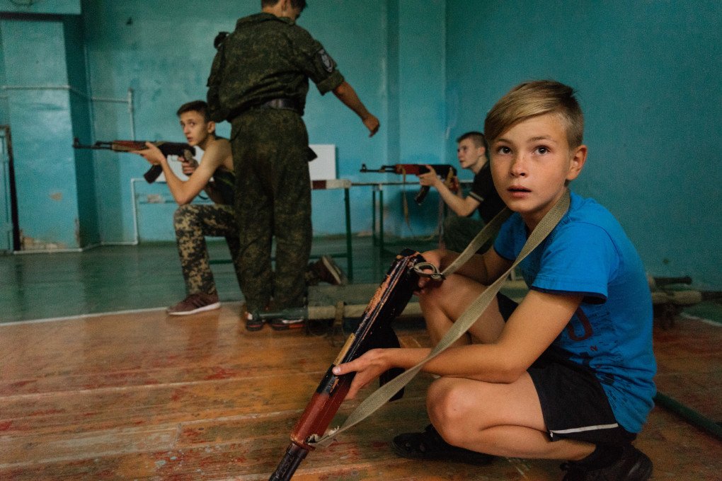 The training of the military-patriotic club Steppen Wolves. Steppen Wolves is a so-called "military patriotic club" for children living in the Russian controlled city of Ilovaisk, Ukraine. (Photo by Joao Bolan via Getty Images) The training of the military-patriotic club Steppen Wolves. Steppen Wolves is a so-called "military patriotic club" for children living in the Russian controlled city of Ilovaisk, Ukraine. (Photo by Joao Bolan via Getty Images)