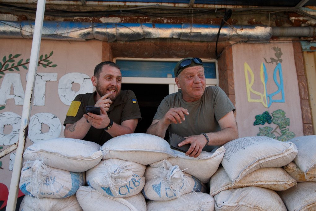Denys, priest and sniper, with Yurii, of Dnipro-1 Battalion at a volunteer base in Pokrovsk. (Source: Jessica Daly UNITED24 Media) Denys, priest and sniper, with Yurii, of Dnipro-1 Battalion at a volunteer base in Pokrovsk. (Source: Jessica Daly UNITED24 Media)