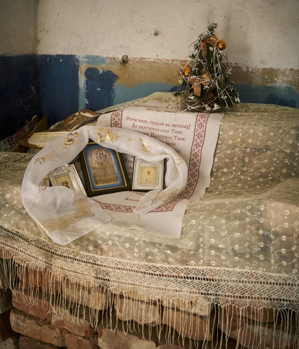 Bozhnytsia - home shrine, or holy corner. In Ukrainian tradition it represents the sacred corner of the home with icons, candles, and embroidered cloths, where people pray, give thanks, and seek peace for the household. December 24, 2025. Izium, Ukraine. Photo by Joshua Olley/UNITED24 Media. Bozhnytsia - home shrine, or holy corner. In Ukrainian tradition it represents the sacred corner of the home with icons, candles, and embroidered cloths, where people pray, give thanks, and seek peace for the household. December 24, 2025. Izium, Ukraine. Photo by Joshua Olley/UNITED24 Media.