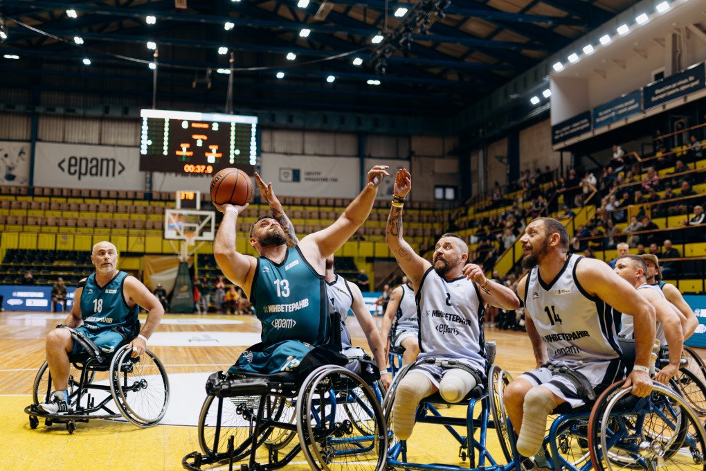 Ukrainian veteran Oleksii Prytula (#8) reaches to intercept a pass from opposing player #13 during a high-intensity moment on the court. Photo: Serhii Halushka, Come Back Alive Foundation Ukrainian veteran Oleksii Prytula (#8) reaches to intercept a pass from opposing player #13 during a high-intensity moment on the court. Photo: Serhii Halushka, Come Back Alive Foundation