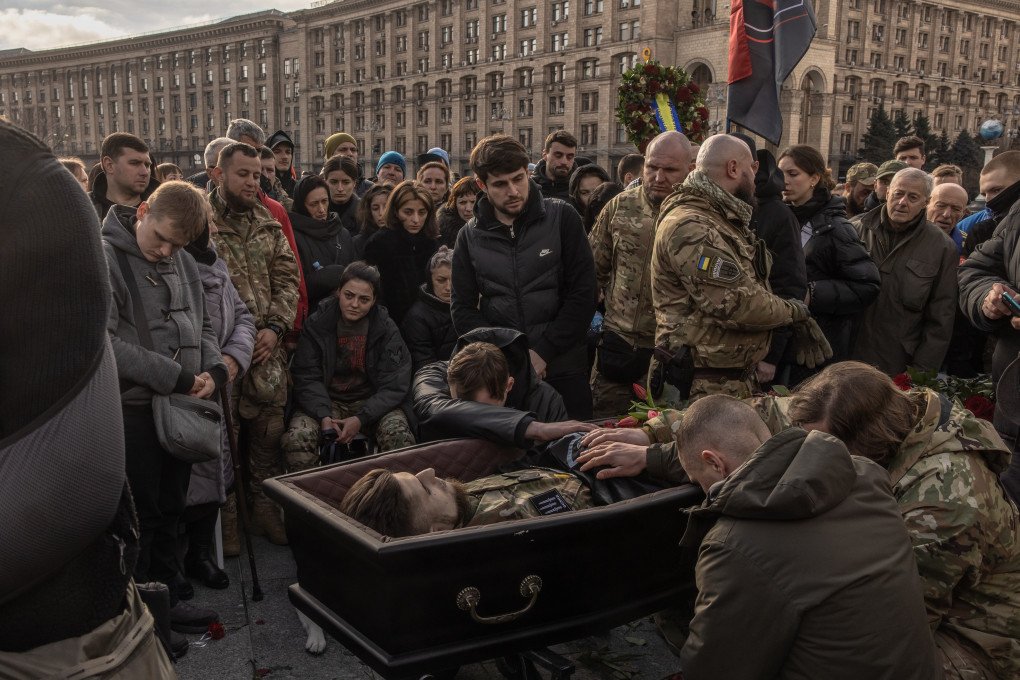 KYIV, UKRAINE - MARCH 10, 2023: Family, friends, and the public gathered at Independence Square in Ukraine’s capital to pay their final respects to Dmytro Kotsiubailo, a revered Ukrainian serviceman known by the call sign "Da Vinci." At just 27 years old, Kotsiubailo was the commander of the First Mechanized Battalion, famously called "Da Vinci Wolves," and was killed by Russia in Bakhmut. (Photo by Roman Pilipey/Getty Images)