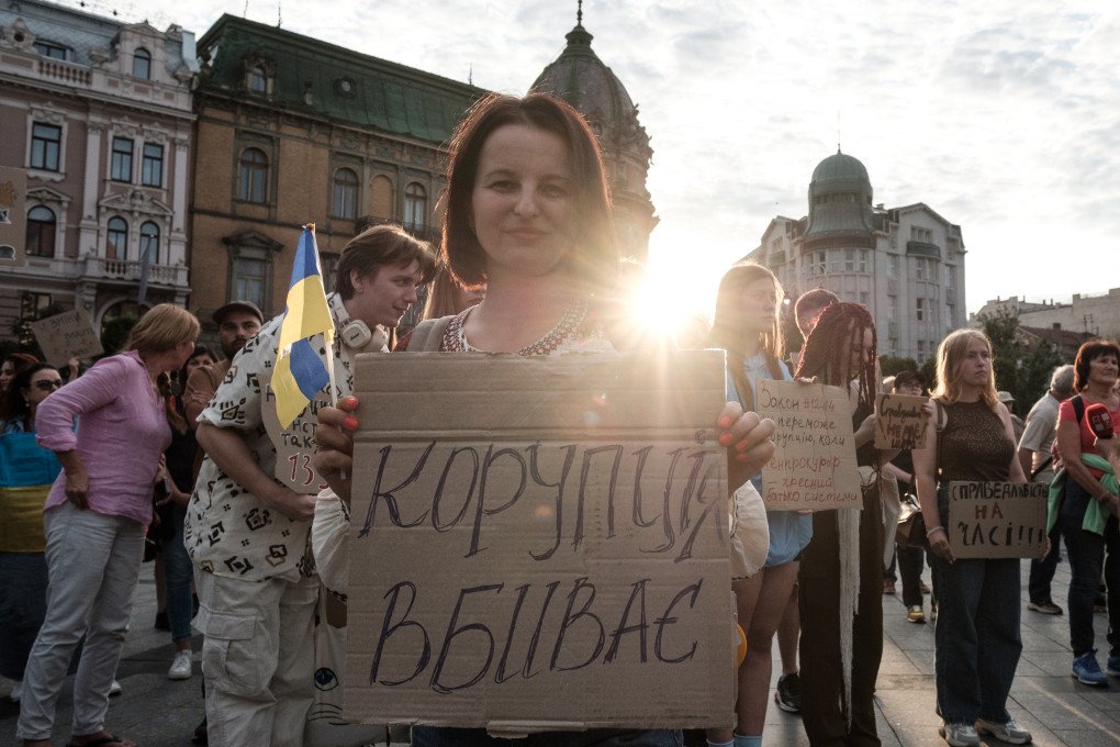 Ukrainian activist with banner “Corruption Kills”. Photo by Les Kasyanov/Global Images Ukraine via Getty Images.