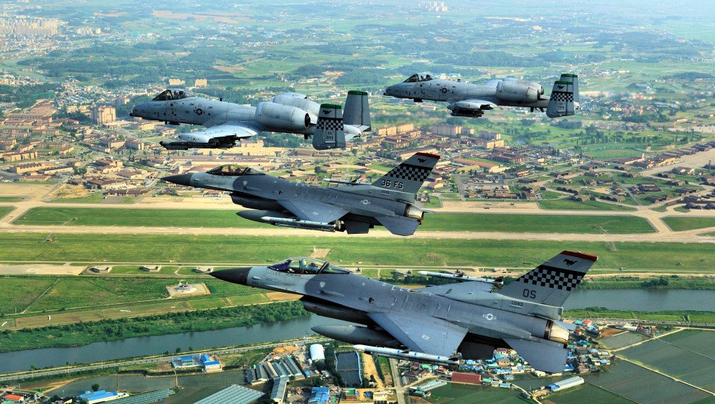 F-16 Falcons and A-10 Thunderbolt IIs fly over the Osan airfield in the Republic of Korea, 2009. (Source: Wikimedia)