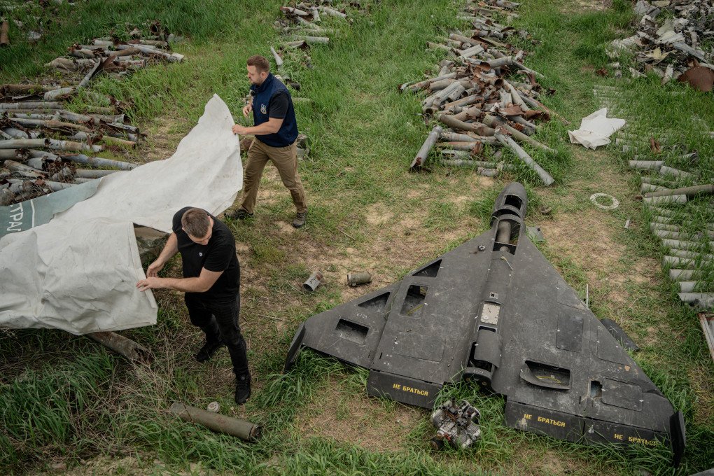 Illustrative image. Spokesperson of the Kharkiv prosecutor and his assistant cover a Russian Shahed drone shot down by Ukraine’s air defense forces in a field used for the storage of Russian missiles in Kharkiv, on April 30, 2025. (Source: Getty Images)