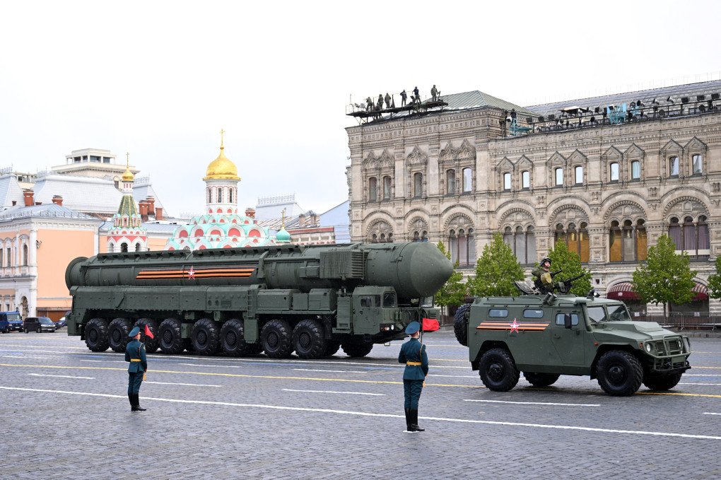 An RS-24 Yars intercontinental ballistic missile system and a Tigr-M all-terrain infantry mobility vehicle drive on Red Square on May 9, 2024.