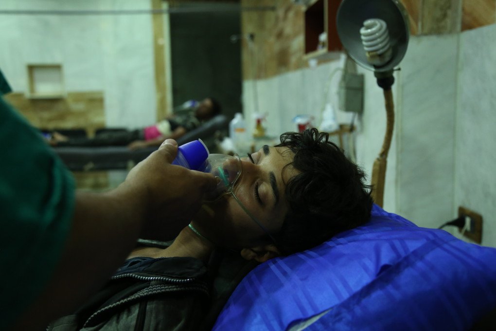 Syrians receive medical treatment after Assad regime's alleged chemical gas attack over oppositions' frontline, where is included in deconfliction zone in East Ghouta of Damascus, Syria on July 13, 2017. (Photo by Ammar Suleyman/Anadolu Agency/Getty Images)